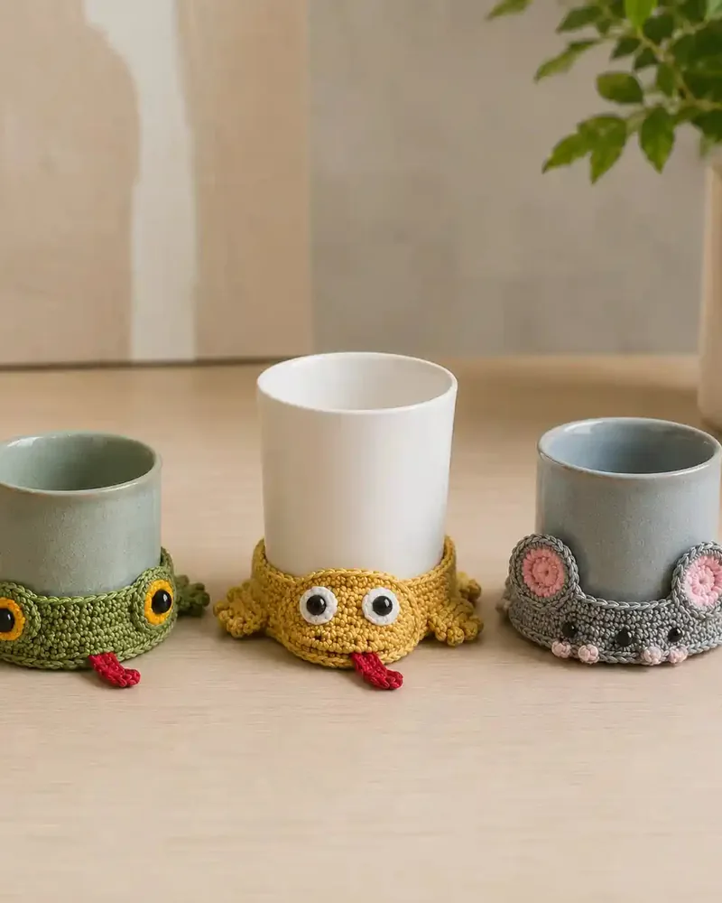 Finished cotton coasters in warm colors, styled next to a mug